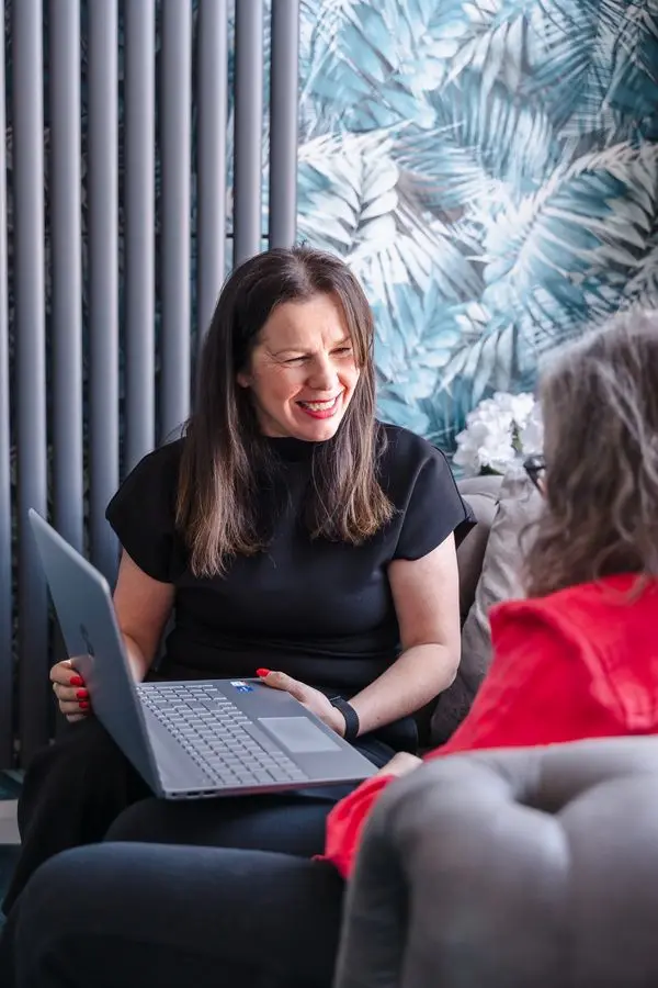 Michelle talking a client through their results