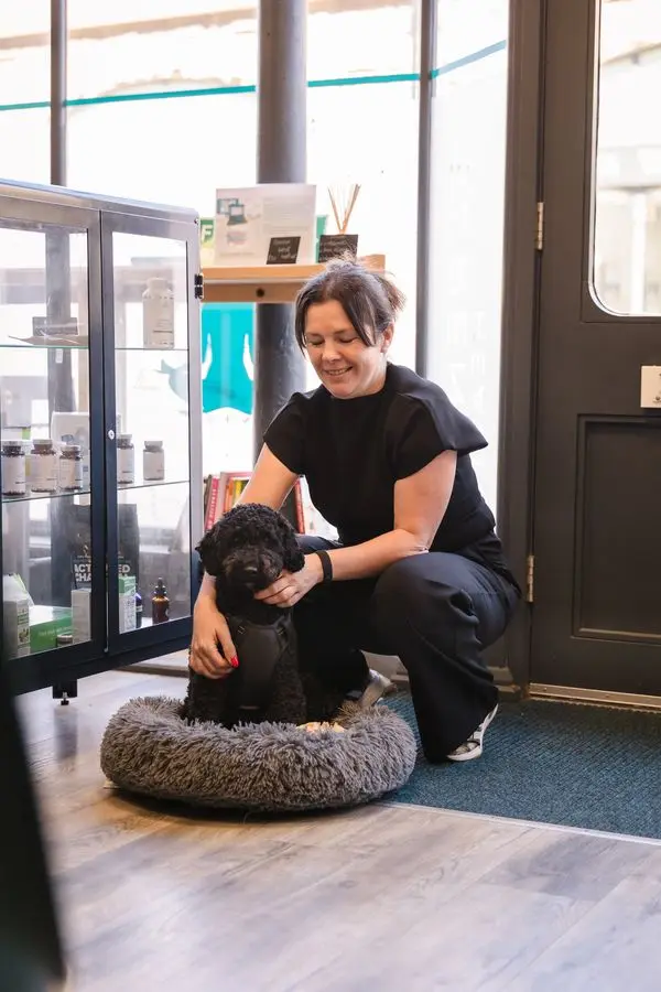 Michelle with Bodhi, the clinic dog